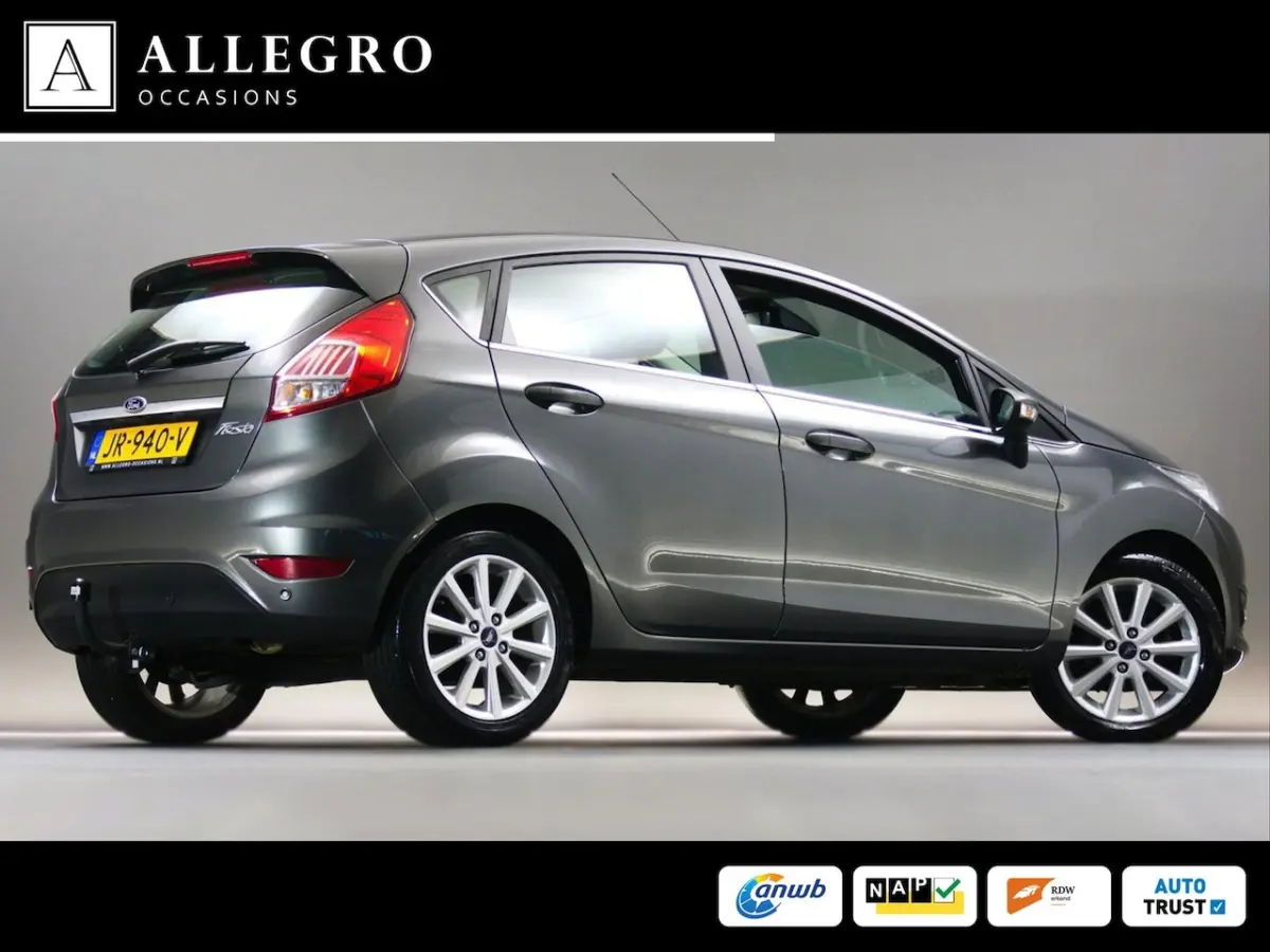 1.0 Titanium (NAVIGATIESYSTEEM, CLIMATE CONTROL, CRUISE CONTROL, PARKEERSENSOREN ACHTER, V