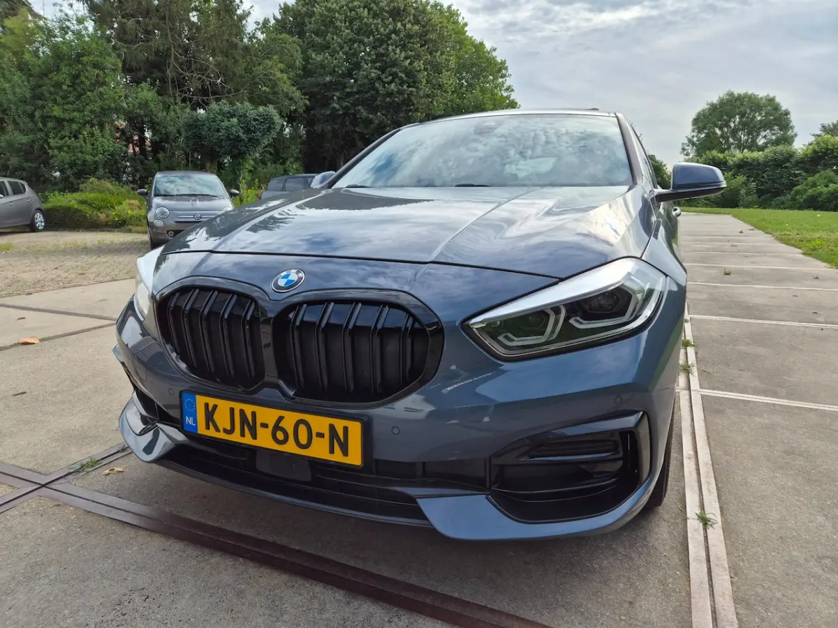 118i - Panoramadak - Memorystoel - Stoelverwarming - Adapt Cruise - Camera - CarPlay - Inc