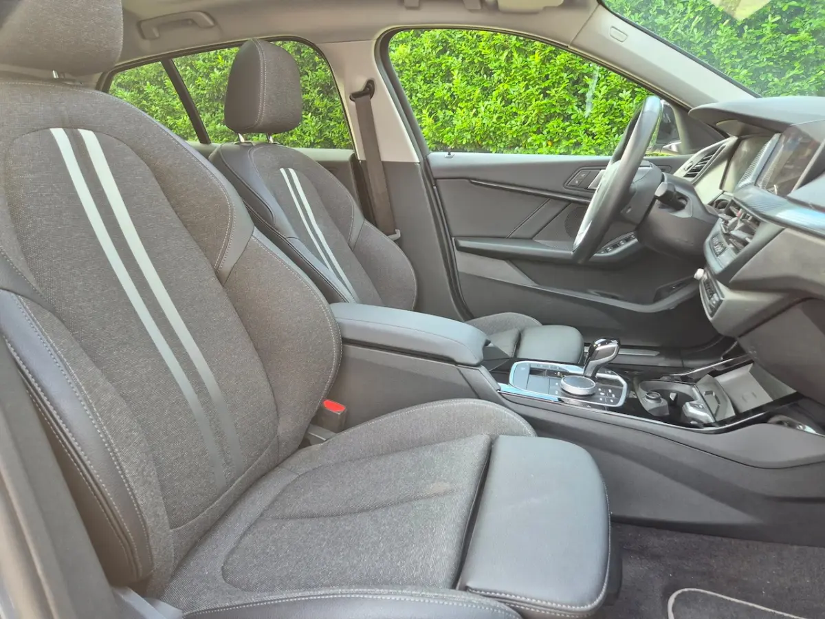 118i - Panoramadak - Memorystoel - Stoelverwarming - Adapt Cruise - Camera - CarPlay - Inc